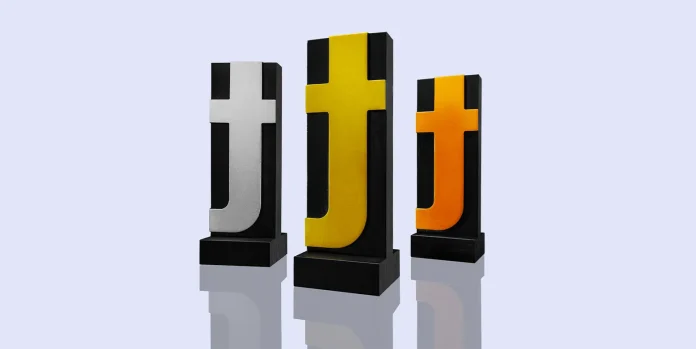 For the first time in its nearly 80-year history, the global Type Directors Club will now present physical Gold, Silver, and Bronze awards, starting with the newly launched TDC72 competition. Previously, all TDC competition winners received the same Certificate of Typographic Excellence. While each winner is among the world's best typographic practitioners, the organization felt it owed it to the profession to acknowledge and elevate the work that stands out above the rest. Called the TDC Type-High award, the handsomely designed physical object can now be displayed on desks and bookshelves, representing achievement of creative excellence and serving as a constant visual inspiration for typographers, type designers, and lettering artists. Gold, Silver, and Bronze Type-High awards and Merit certificates will be presented starting this year. The new award was designed and named by Graham Clifford, longtime TDC collaborator, life member, and organization Chairman Emeritus. Among his primary considerations were that the award should be a statement piece suitable for display, reflect the TDC's long and rich history, and utilize a manufacturing process that prioritizes sustainable materials to create an environmentally friendly object. The newly minted piece balances a tip of the hat with a knowing wink. It's milled from a single piece of sustainably harvested bamboo, and rests on a plinth. The award stands a stately 7 inches (or 42 picas) tall and measures exactly 0.918 inches deep, the precise thickness of traditional foundry type. In a clever design detail, the Franklin Gothic Condensed lowercase 